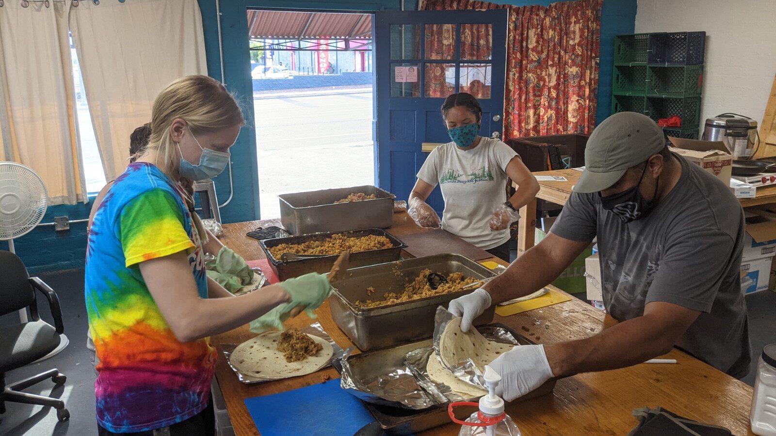 Volunteers wrap burritos at Tucson Food Share